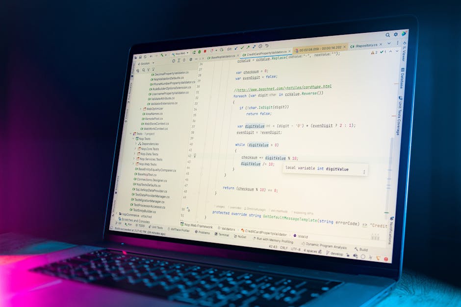 Close-up view of a computer screen displaying lines of HTML code with various tags, attributes, and color-coded syntax, including elements related to images and captions. The background is dark, and t